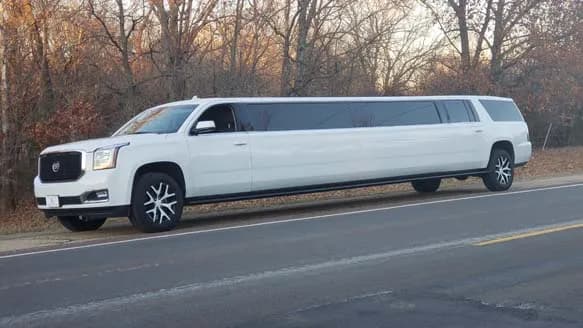 White GMC Yukon stretch limousine with gullwing door from the Avi Limo fleet
